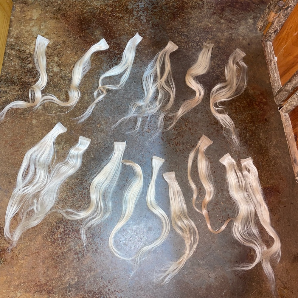 Real hair extensions NEW (washed once) I have 22.5 inch hand tied & tape ins